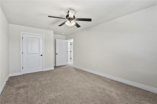 unfurnished bedroom featuring carpet and ceiling fan