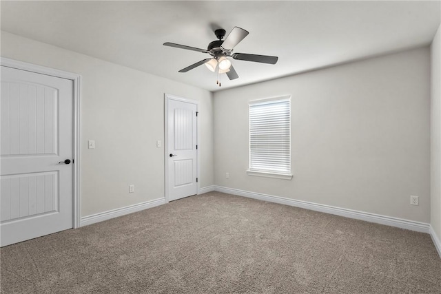 unfurnished bedroom featuring carpet and ceiling fan