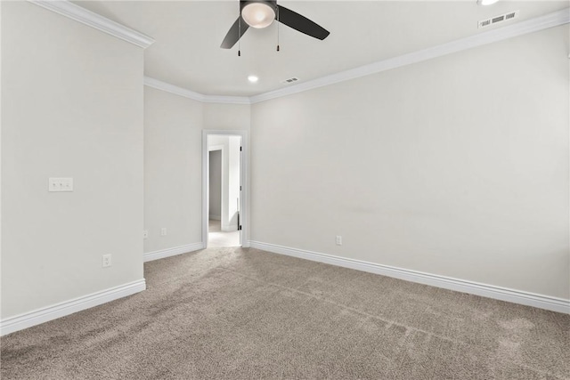 carpeted empty room with ornamental molding and ceiling fan