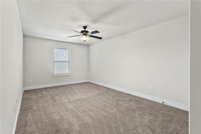 unfurnished room featuring ceiling fan and carpet