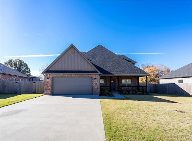 view of front of property with a garage and a front lawn