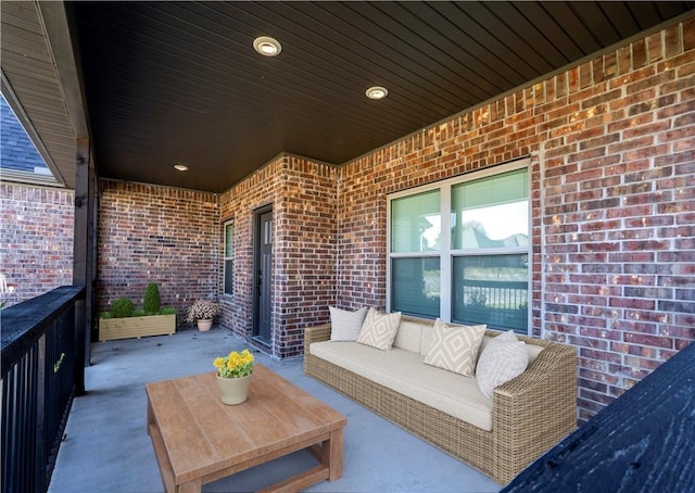 view of patio / terrace with a balcony and an outdoor hangout area