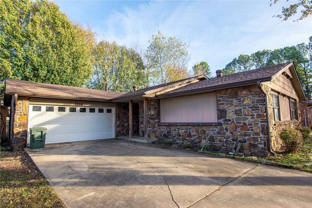 ranch-style home with a garage