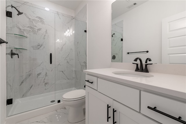 bathroom with vanity, an enclosed shower, and toilet