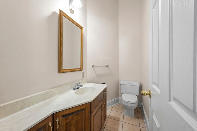 bathroom with tile patterned floors, vanity, and toilet