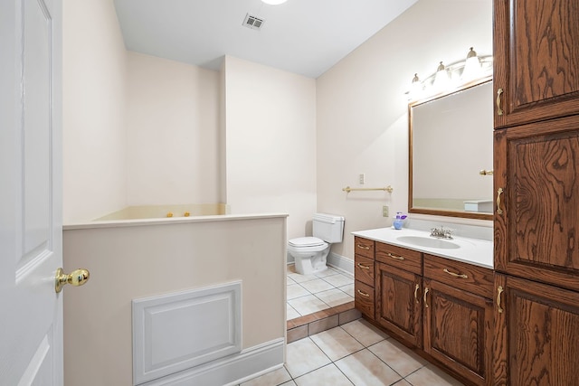 bathroom featuring tile patterned flooring, vanity, and toilet