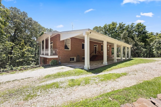 view of side of property featuring a patio