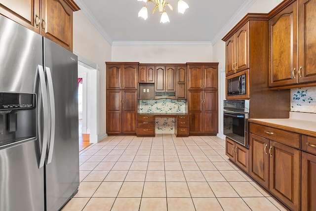 kitchen featuring tasteful backsplash, an inviting chandelier, ornamental molding, and black appliances