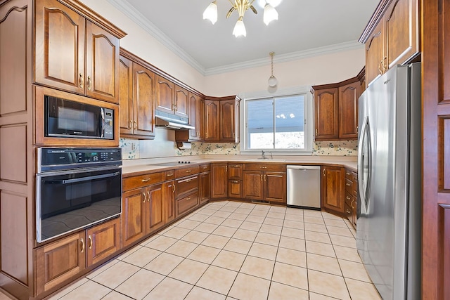 kitchen featuring black appliances, sink, hanging light fixtures, ornamental molding, and a chandelier