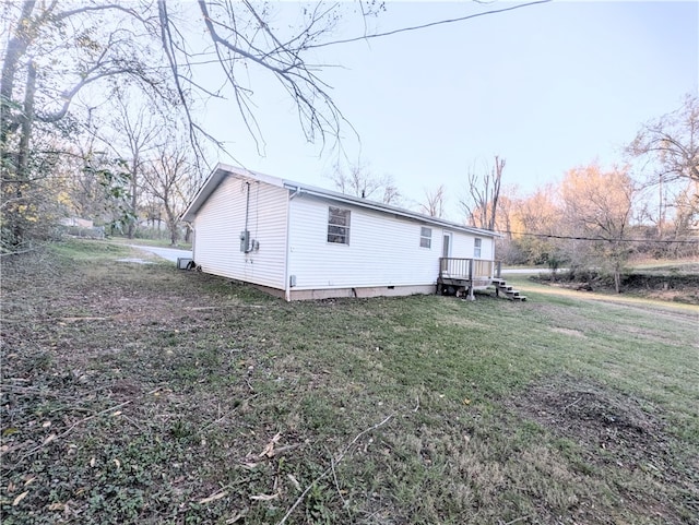 view of home's exterior featuring a yard