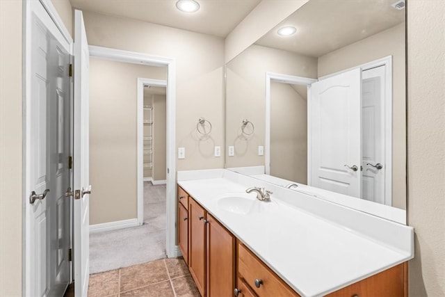 bathroom featuring tile patterned flooring and vanity