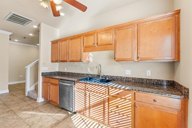 kitchen featuring ceiling fan, sink, stainless steel dishwasher, dark stone countertops, and light tile patterned floors