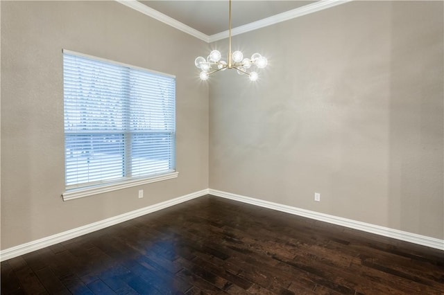 empty room with ornamental molding, a chandelier, dark wood finished floors, and baseboards