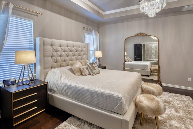 bedroom with arched walkways, a notable chandelier, visible vents, dark wood-style floors, and crown molding