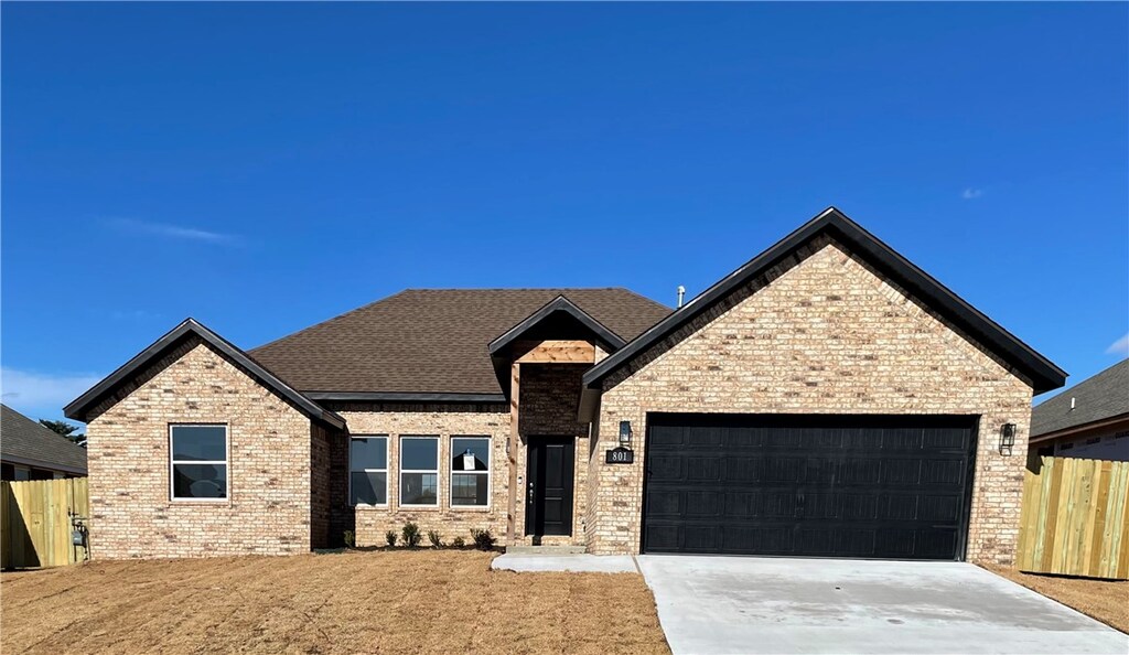 708 W Shane St, Siloam Springs, AR 72761 - view of front facade featuring a garage