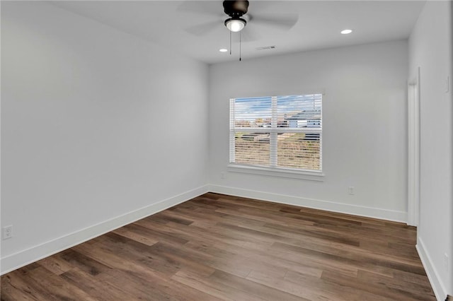 spare room featuring ceiling fan and hardwood / wood-style flooring