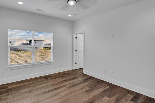 unfurnished room with ceiling fan and hardwood / wood-style floors