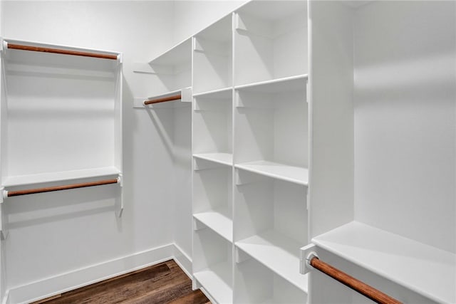 walk in closet featuring dark hardwood / wood-style flooring