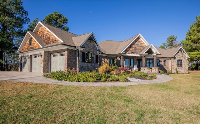 craftsman-style house featuring a front lawn and a garage