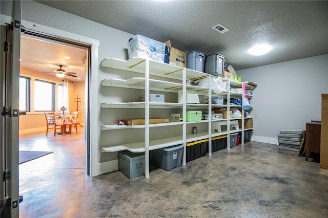 storage area featuring ceiling fan