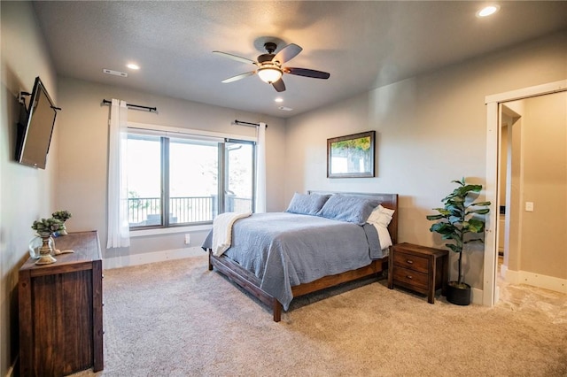 bedroom featuring light carpet and ceiling fan