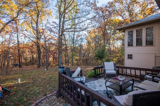 wooden deck with a patio and an outdoor hangout area