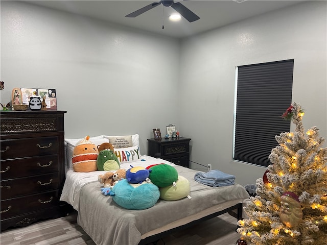 bedroom featuring light wood-type flooring and ceiling fan