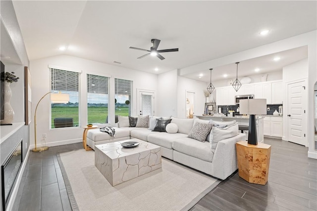 6309 NW Harley St, Bentonville, AR 72713 - living area with a ceiling fan, dark wood-style floors, recessed lighting, and lofted ceiling