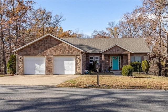 ranch-style house featuring a garage