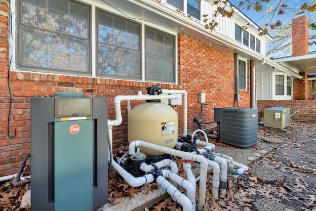 view of side of property featuring central AC unit