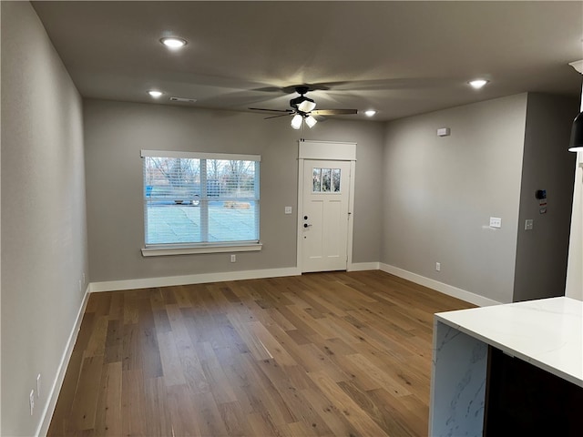 entryway with hardwood / wood-style floors and ceiling fan