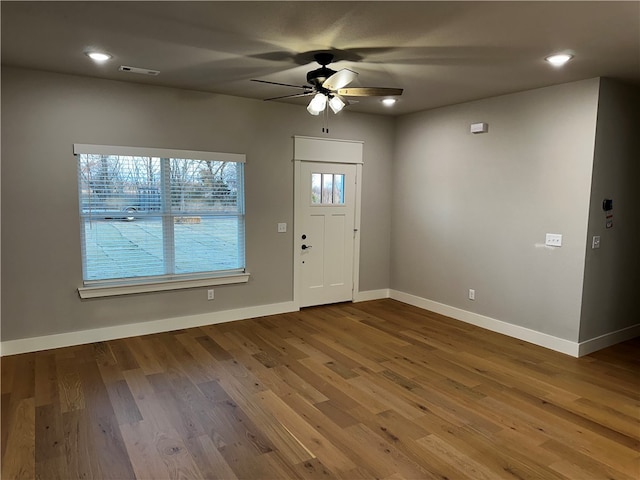 foyer with ceiling fan and hardwood / wood-style floors