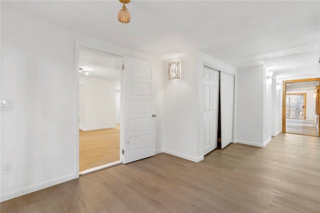 10305 Jims Trl, Rogers, AR 72756 - empty room featuring wood finished floors and baseboards