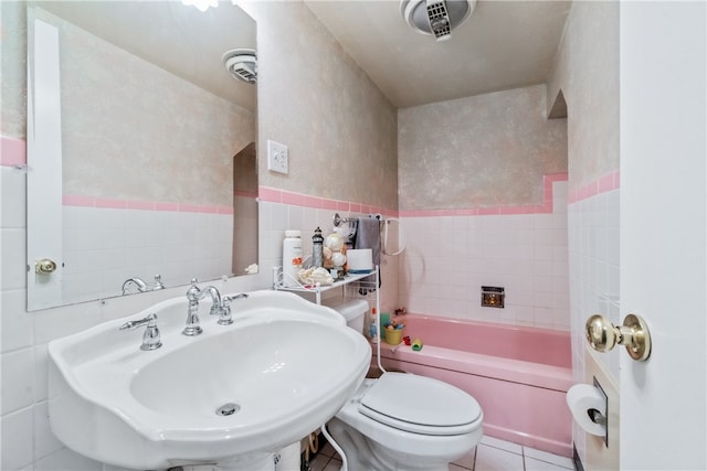 full bathroom with tile patterned floors, tub / shower combination, sink, tile walls, and toilet