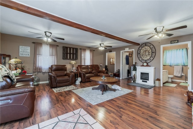 living room with hardwood / wood-style floors and beam ceiling