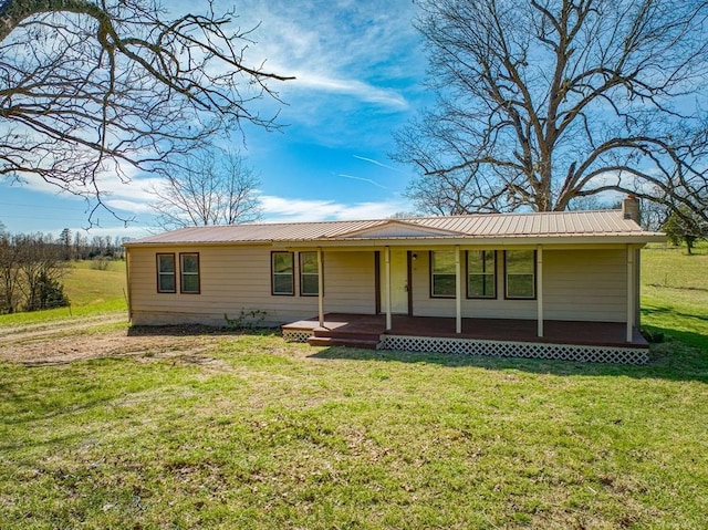 view of front of home with a front yard and covered porch