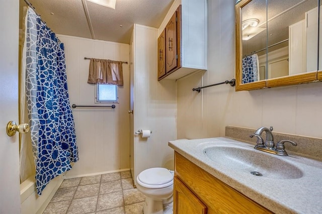 full bathroom featuring shower / tub combo, vanity, a textured ceiling, and toilet