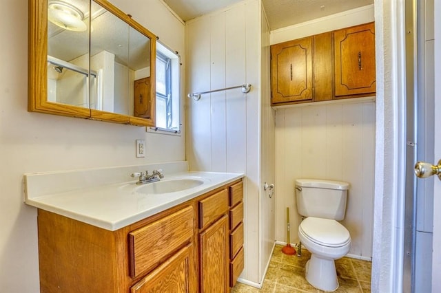 bathroom with vanity, toilet, and a shower with shower door