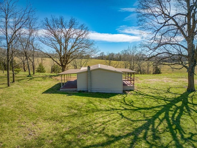 view of yard with a rural view