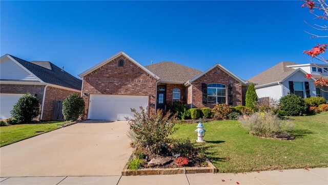 view of front of property with a front lawn and a garage