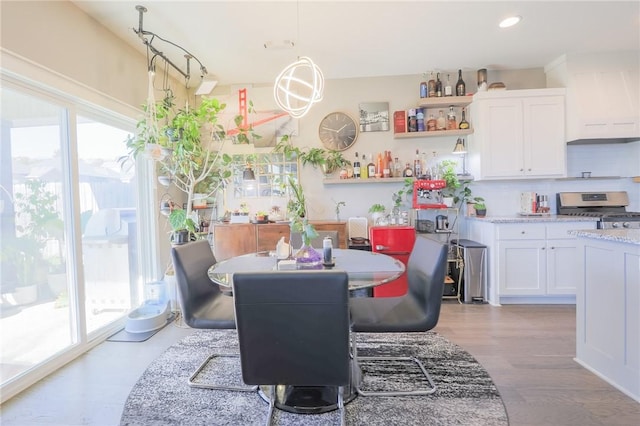 dining area featuring recessed lighting, plenty of natural light, and light wood-style flooring