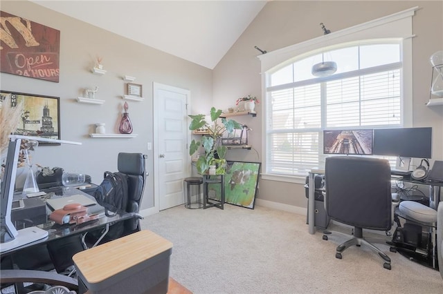 office area featuring vaulted ceiling, baseboards, and carpet floors