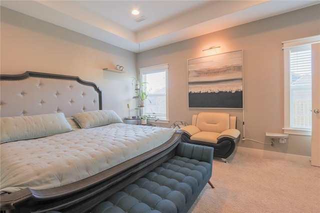 carpeted bedroom with recessed lighting, visible vents, multiple windows, and baseboards