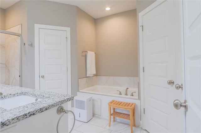 bathroom with vanity, a garden tub, recessed lighting, and a stall shower