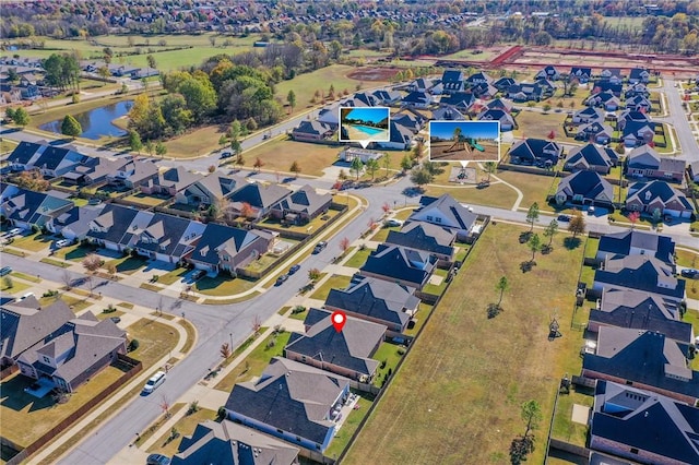 aerial view with a residential view and a water view