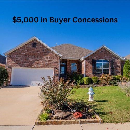 ranch-style home with a front yard and a garage