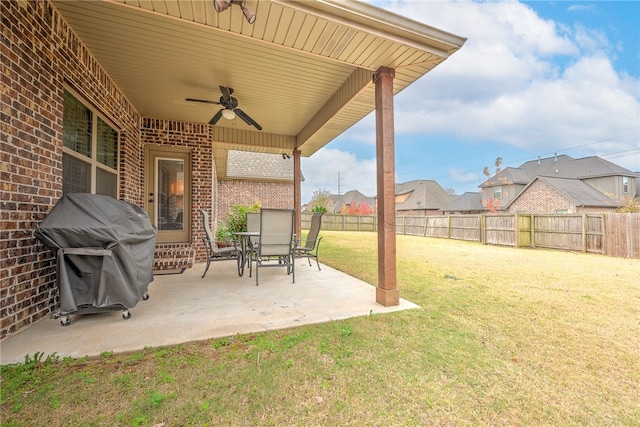 view of yard featuring ceiling fan and a patio area