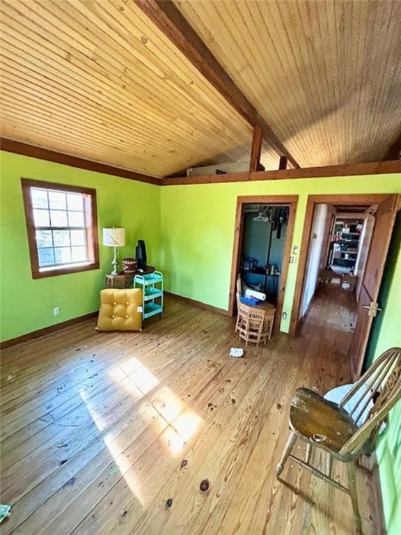 miscellaneous room featuring lofted ceiling with beams, hardwood / wood-style flooring, and wooden ceiling