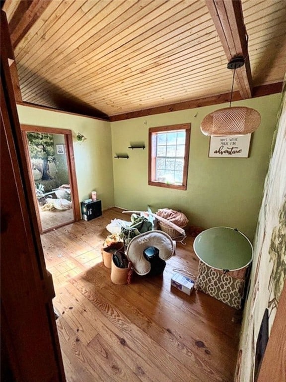 dining room with light hardwood / wood-style floors and wood ceiling