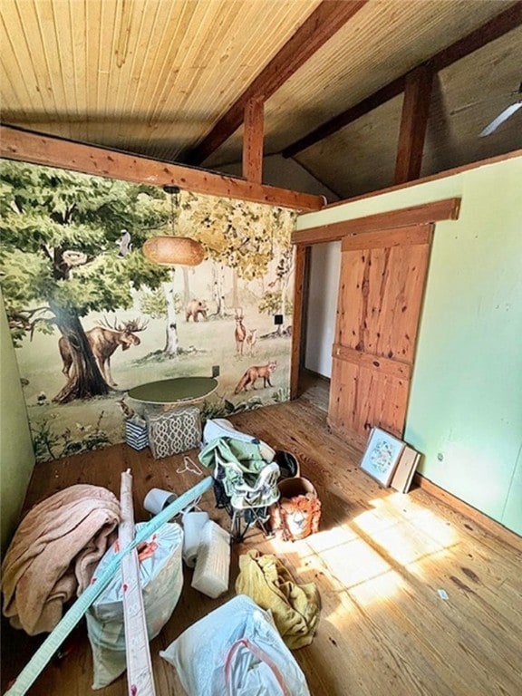 misc room with vaulted ceiling with beams and wood-type flooring